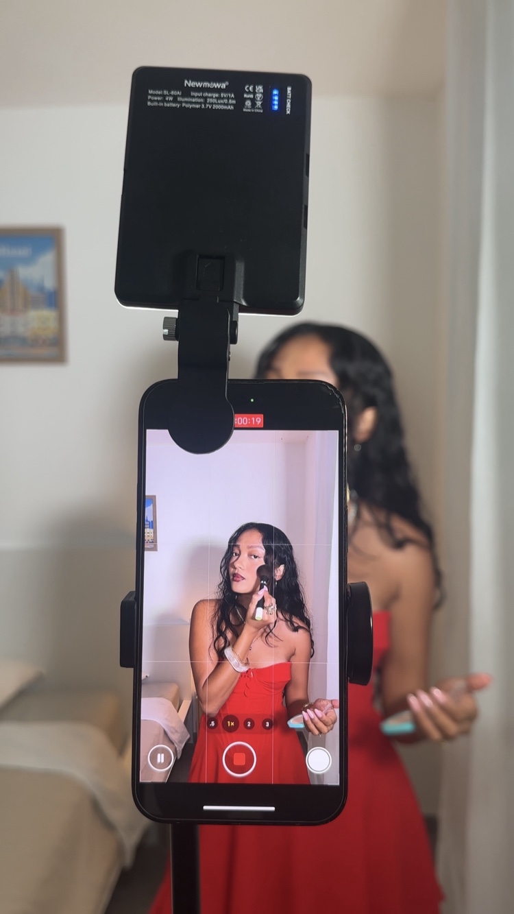 Nianch filming UGC content with phone on tripod and ring light